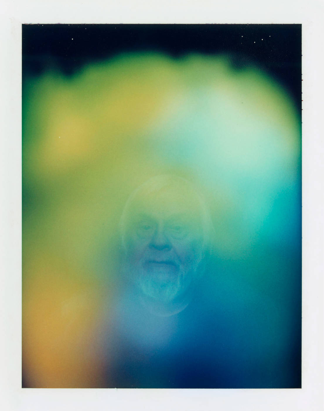 Portrait of man enveloped in hazy gradient color