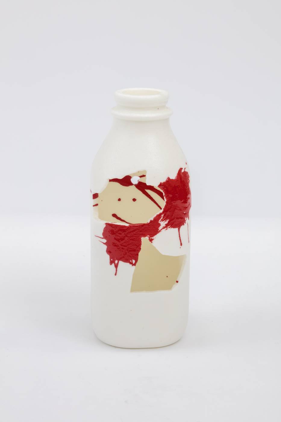 Bottle sculpture with splashes of cream and red color