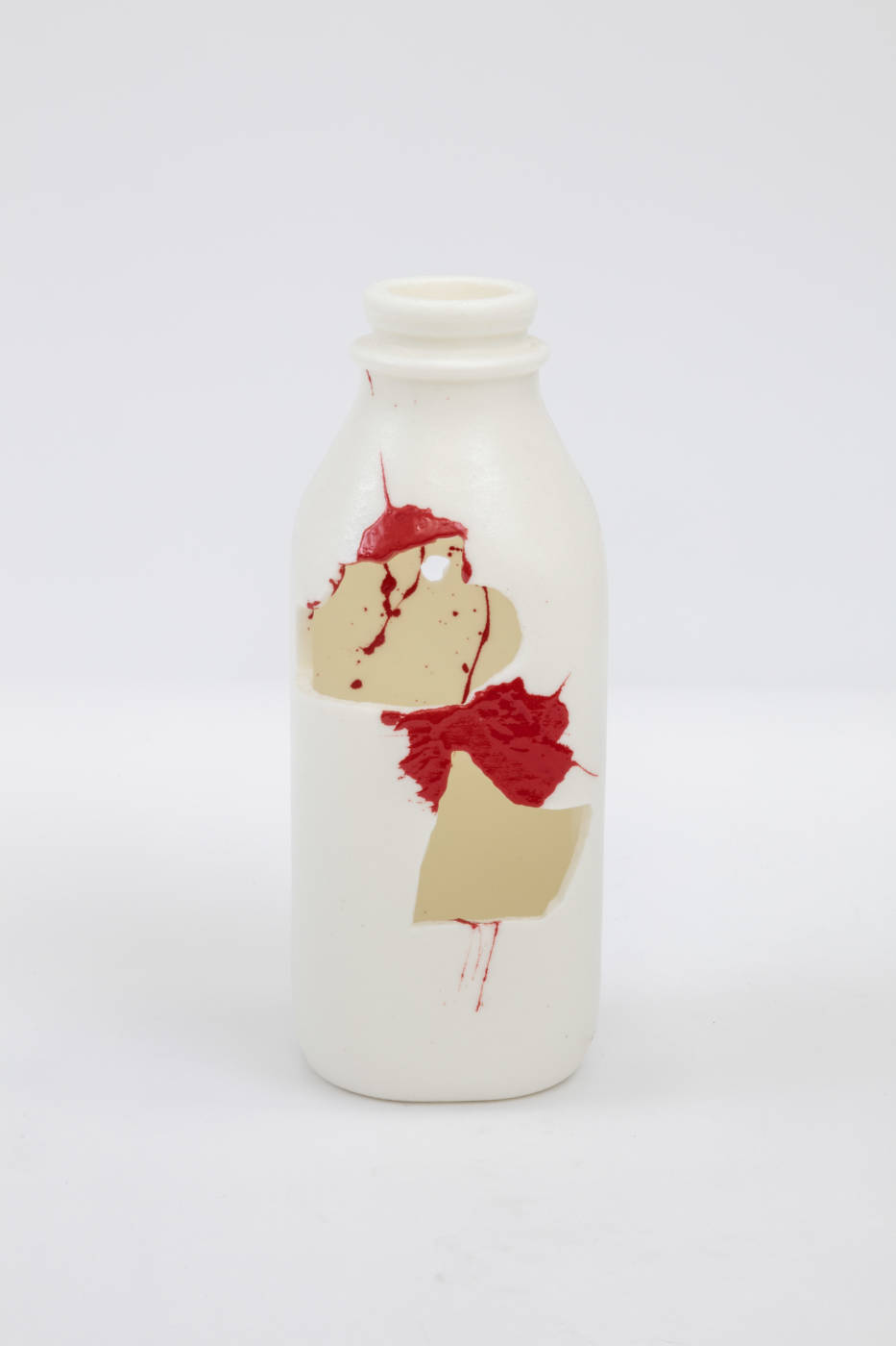 Bottle sculpture with splashes of cream and red color